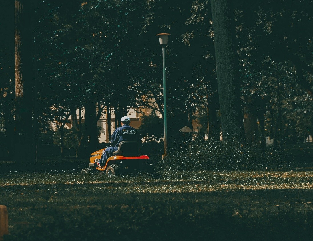Person mowing lawn