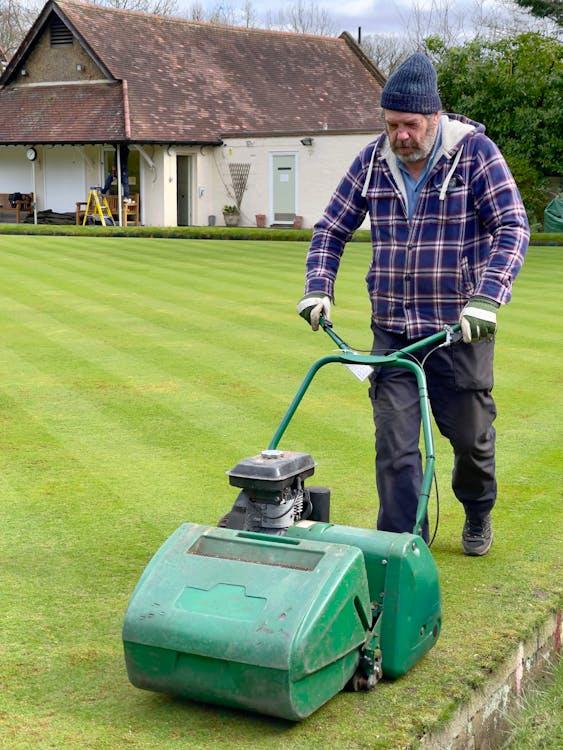A well-maintained residential lawn after mowing and fertilization