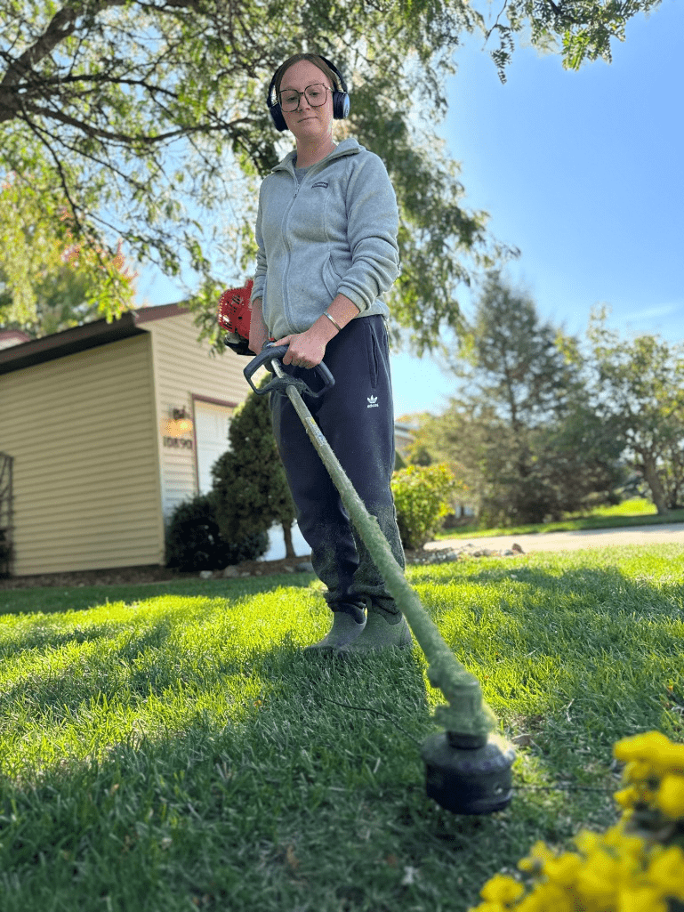 Grass being mowed and trimmed