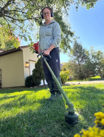 Careful lawn mowing and trimming along beds keeps edges tidy without cutting turf below a healthy height.