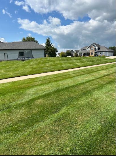 Neighborhood lawns stay clear through peak leaf drop with a steady lawn mowing service in Wyoming, MI.