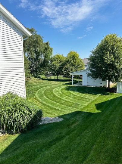 Late-season lawn care in Allendale, MI keeps side yards trimmed and clear before the first lasting snow.